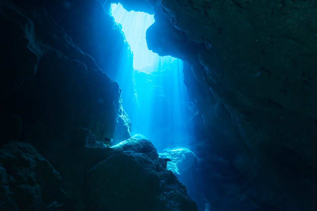 Rays of sunlight into the underwater cave